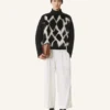 Pull à col roulé en laine et cuir intarsia