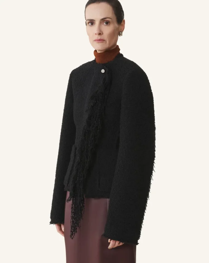Veste asymétrique en laine bouclée